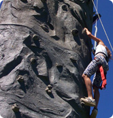 Person Climbing a Rock Wall