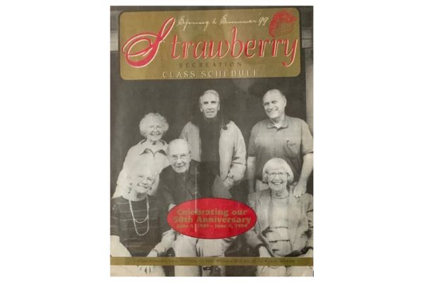 A group of six older adults, four women and two men, are seated and standing together, smiling for a photo on the cover of a recreation class schedule.