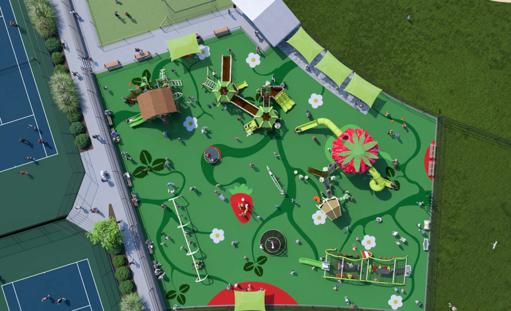 Aerial view of a vibrant green playground with various play structures, slides, and climbing equipment, surrounded by tennis courts and grassy areas.